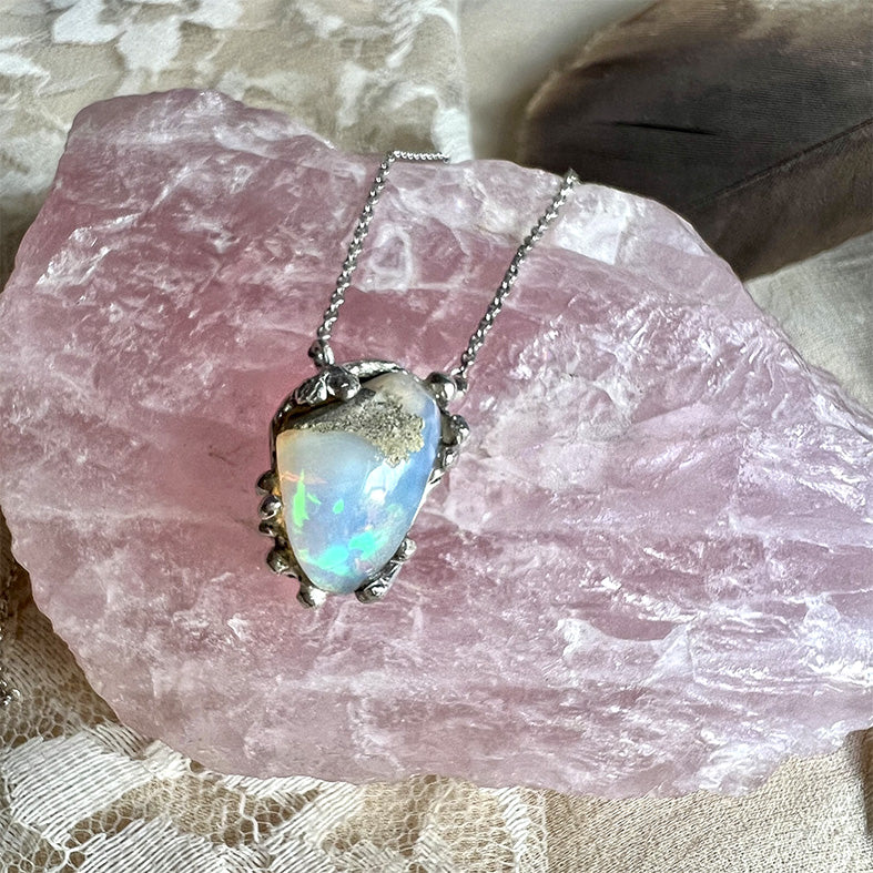 Elmwoods Auctions | AN OPAL, AQUAMARINE AND DIAMOND PENDANT AND CHAIN